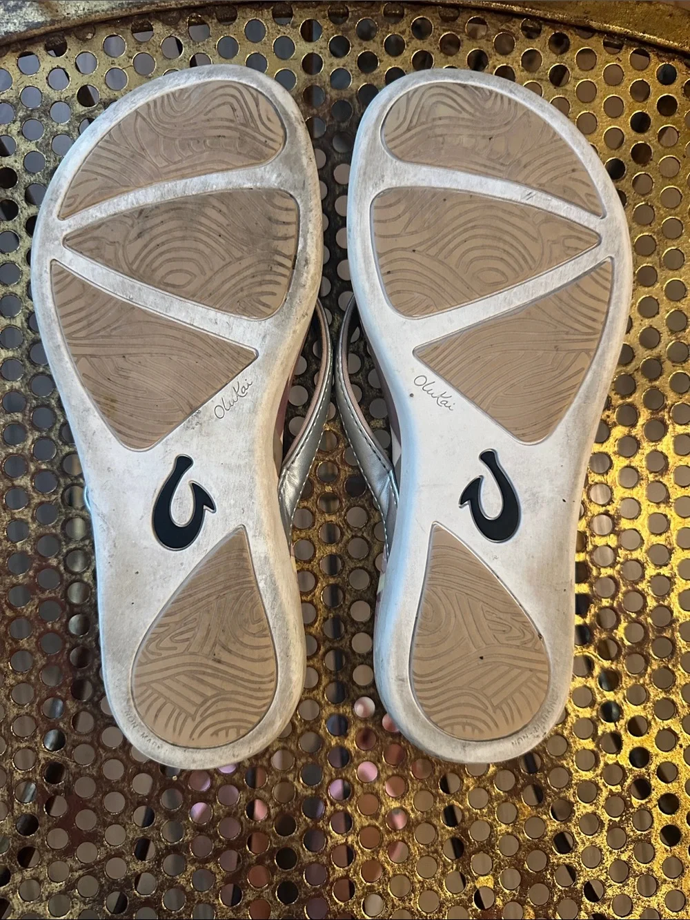 OluKai Metallic Silver Flip Flops with Purple Floral Accent